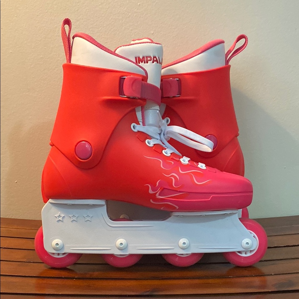 Red and White Roller Skates with Flame Design